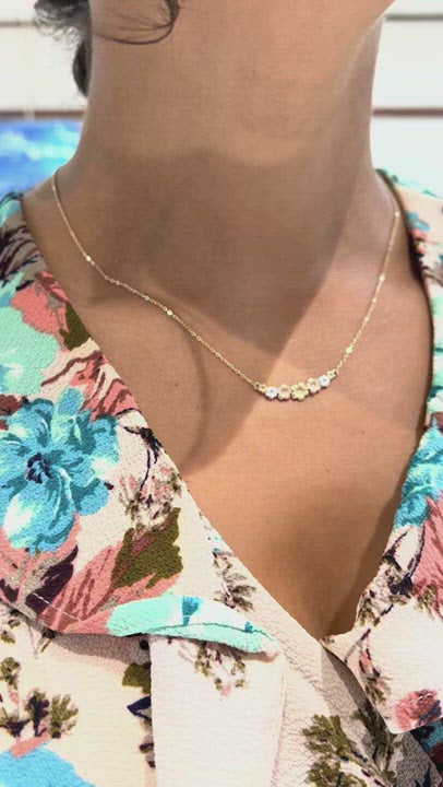 Video of a woman wearing an adjustable Plumeria Necklace in Tri Color Gold with Diamonds - 25mm - Maui Divers Jewelry