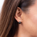 A woman's ear with Hawaiian Heritage Black Coral Earrings in Gold - Maui Divers Jewelry