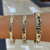 A woman's wrist with three sizes of HAwaiian Heirloom Kuuipo (Sweetheart) Plumeria Enamel Bracelet in Gold - 6mm - Maui Divers Jewelry