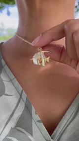 Video of a woman showing a Sealife Angelfish Mother of Pearl Pendant in Gold with. Diamonds - 23mm - Maui Divers Jewelry