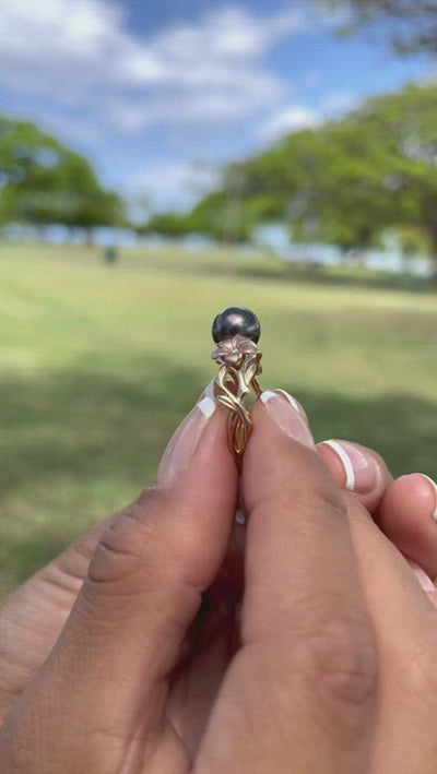 Video of a woman's hand wearing a Sealife Seahorse Black Coral Ring in Gold with Diamonds - 15mm - Maui Divers Jewelry