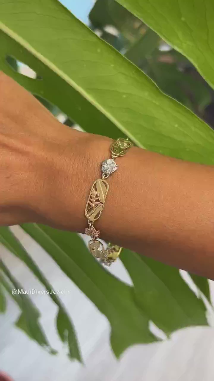 Video of a woman's wrist with a Hawaiian Gardens Hibiscus Bracelet in Multi Tone Gold with Diamonds - Maui Divers Jewelry